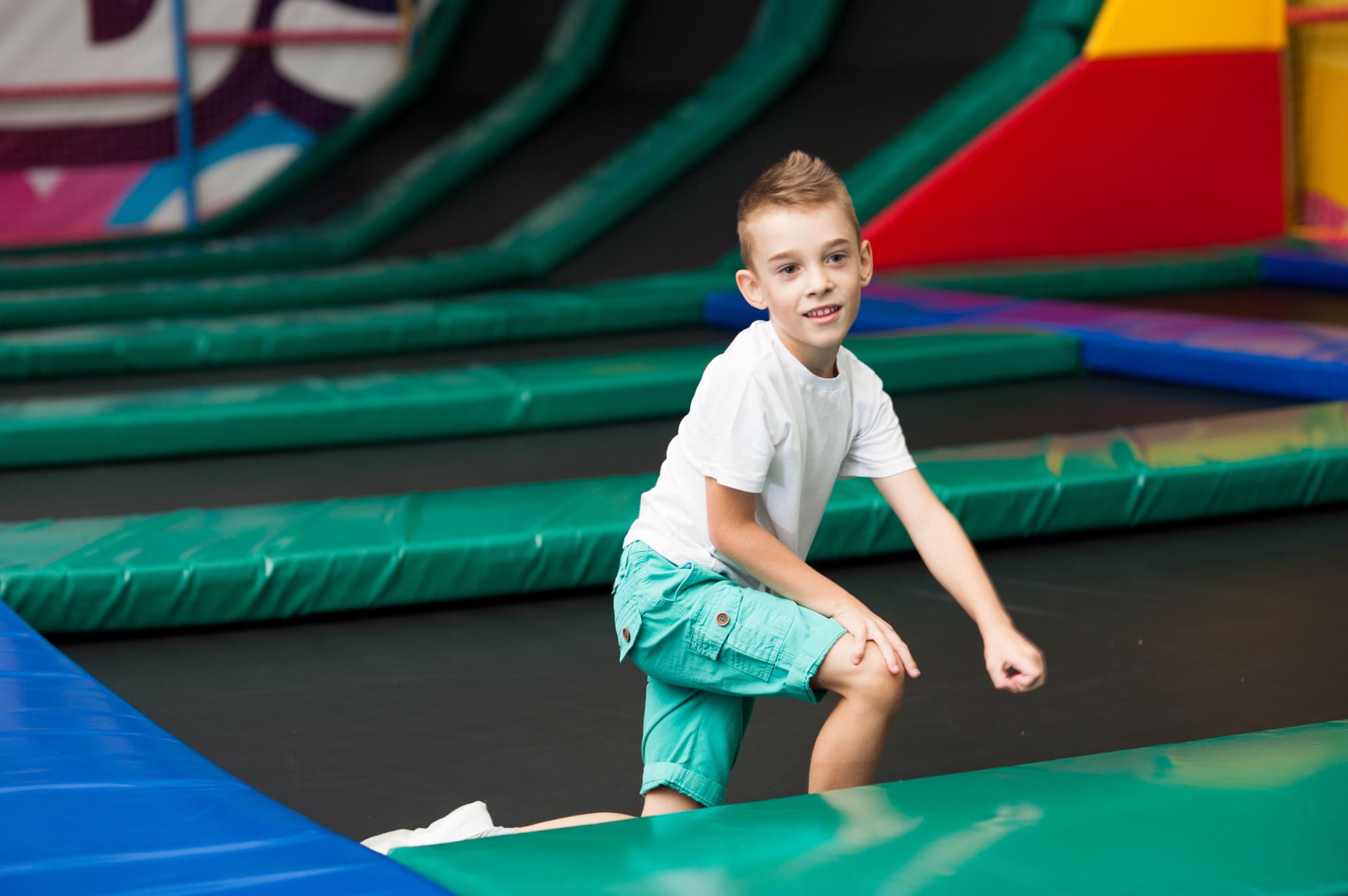 Little boy jumping on a trampoline